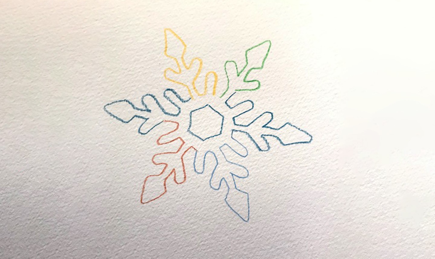 colorful snowflake outline in watercolor pencil