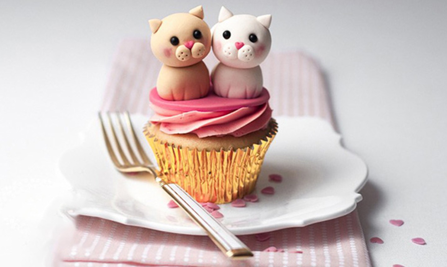 cupcake decorated with cat and dog