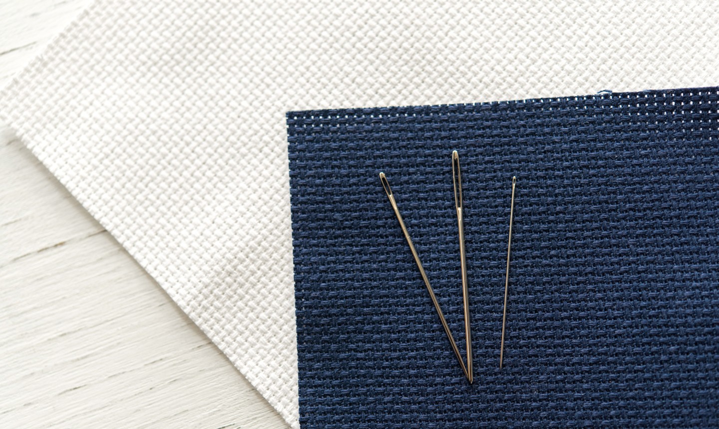 three sewing needles