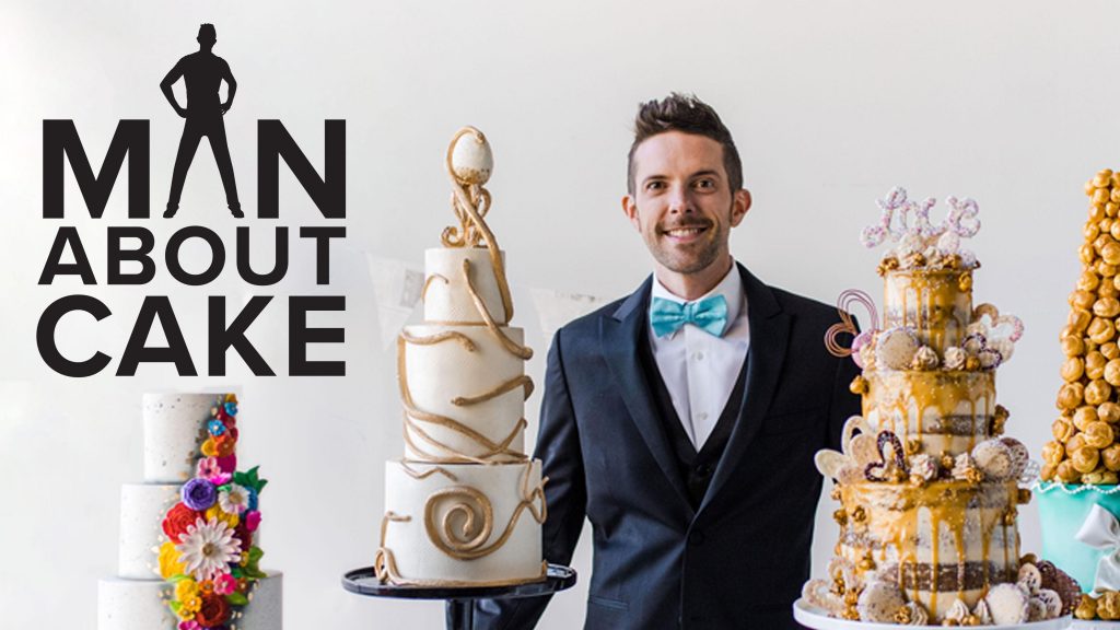 Man with tiered decorated cakes