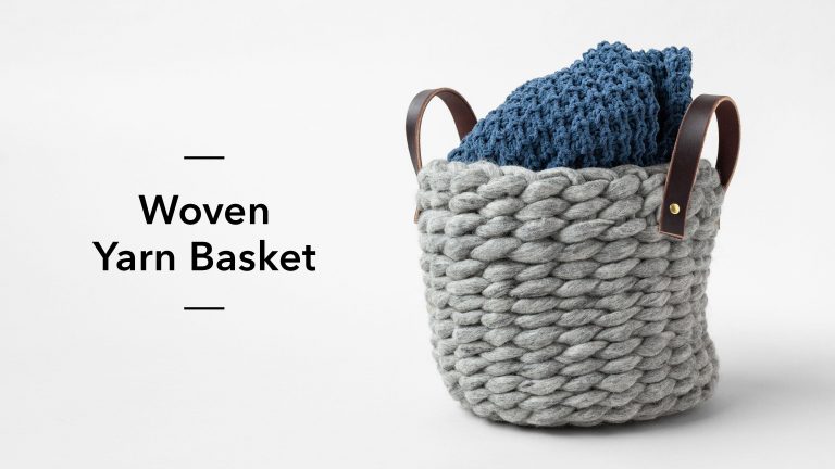 Woven yarn basket with a blanket in it