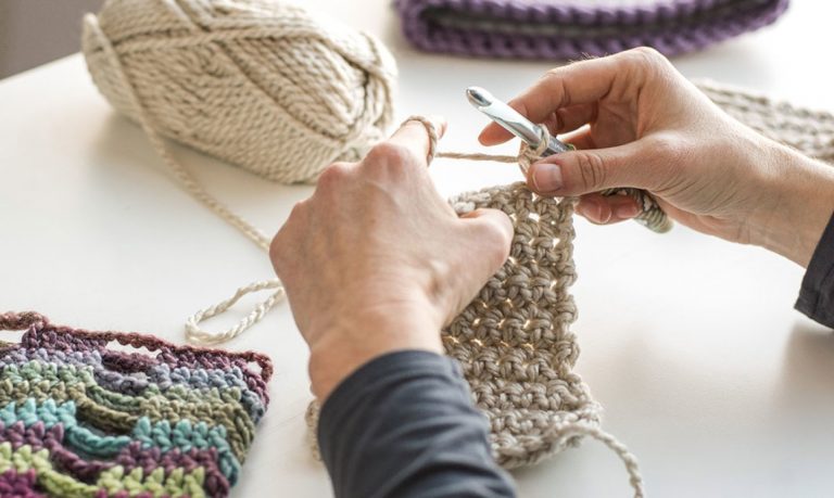Crocheting a tan yarn square