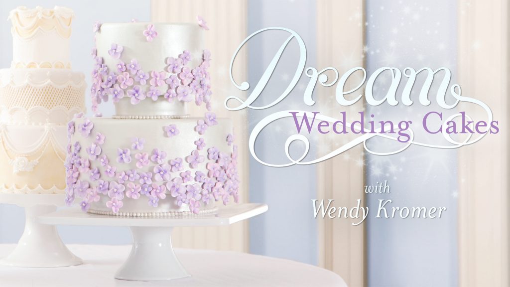 Wedding cake decorated with purple flowers