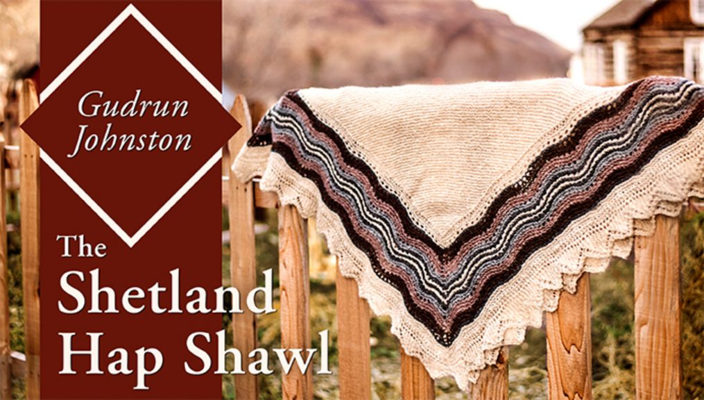 Shetland hap shawl over a fence