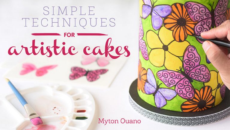 Painting a cake with flowers and butterflies