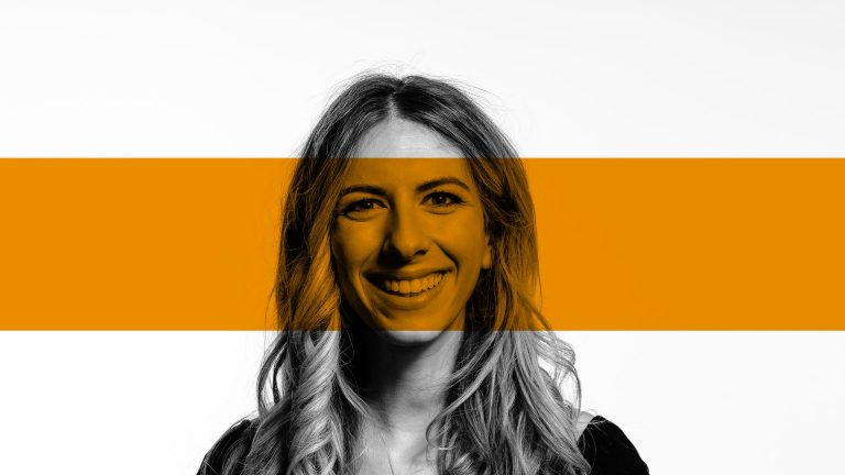 Picture of a woman with an orange bar across the photo
