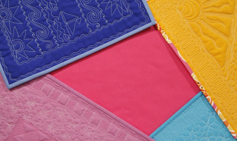 Colorful free motion quilted squares
