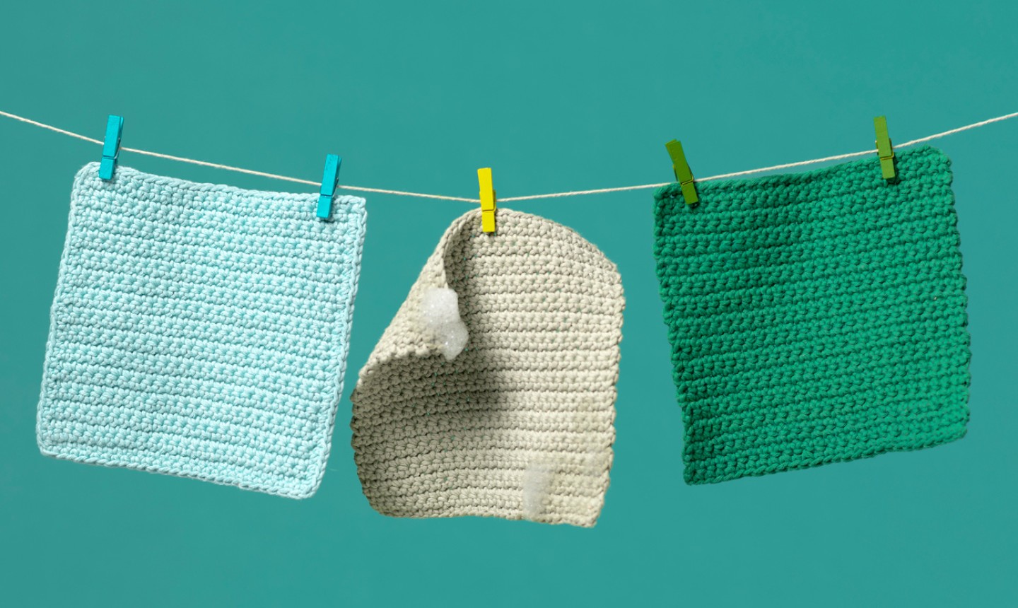 Dishcloths hanging from a line