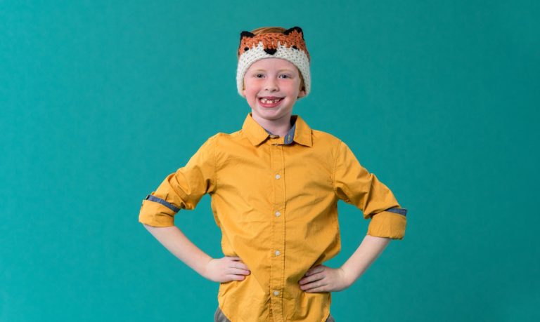 child wearing crochet fox headband