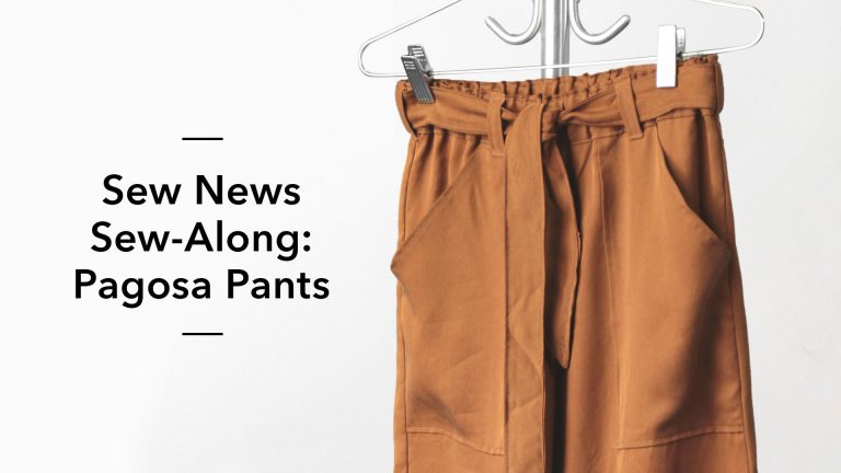 Brown tie waste pants on a pants hanger
