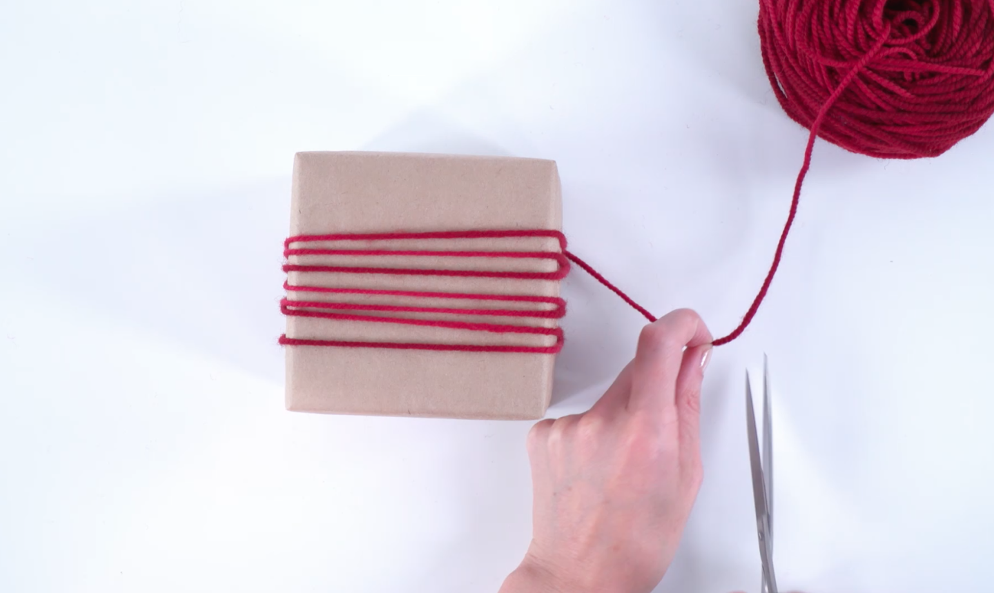 wrapping gift in yarn