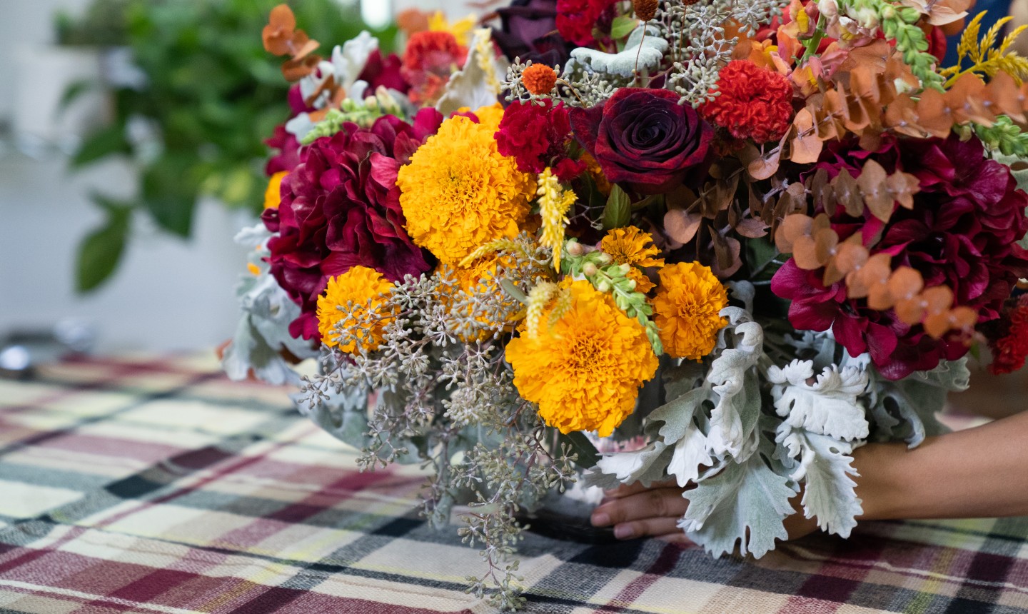 placing a fall flower centerpiece