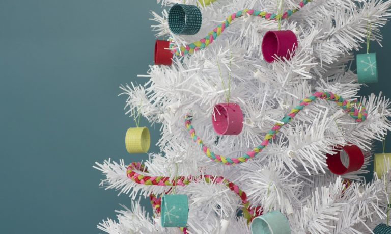 stash busting ornaments on a white tree