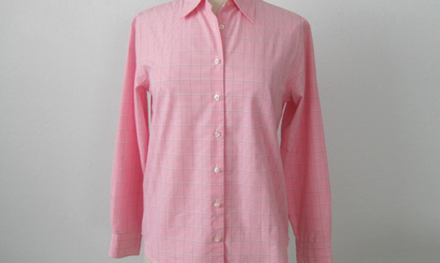 button down pink shirt on a mannequin