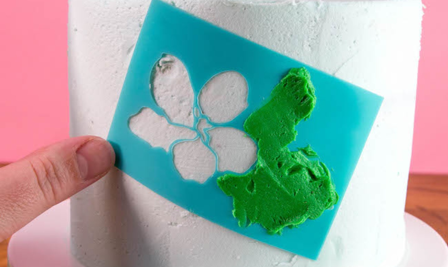 stenciling flower leaves on cake