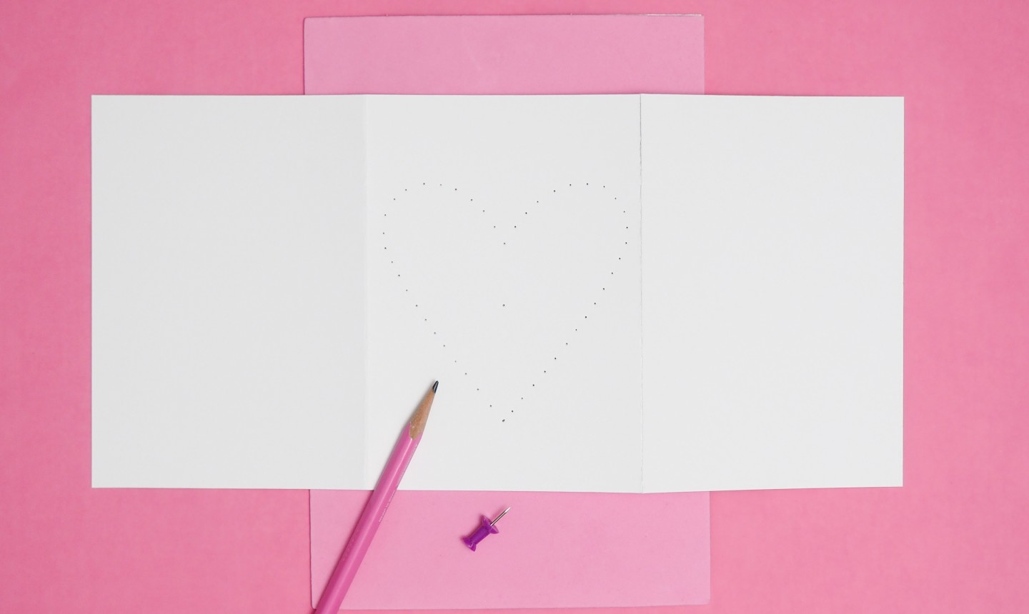 punched heart outline on a card