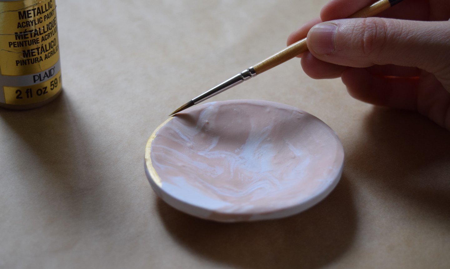 painting gold rim on jewelry dish