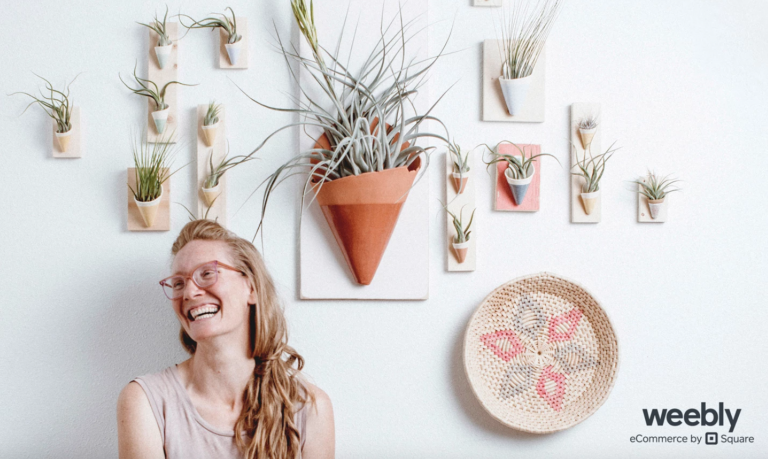 woman with wall succulent planters