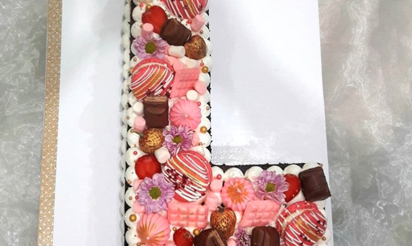 candy-decorated L cake