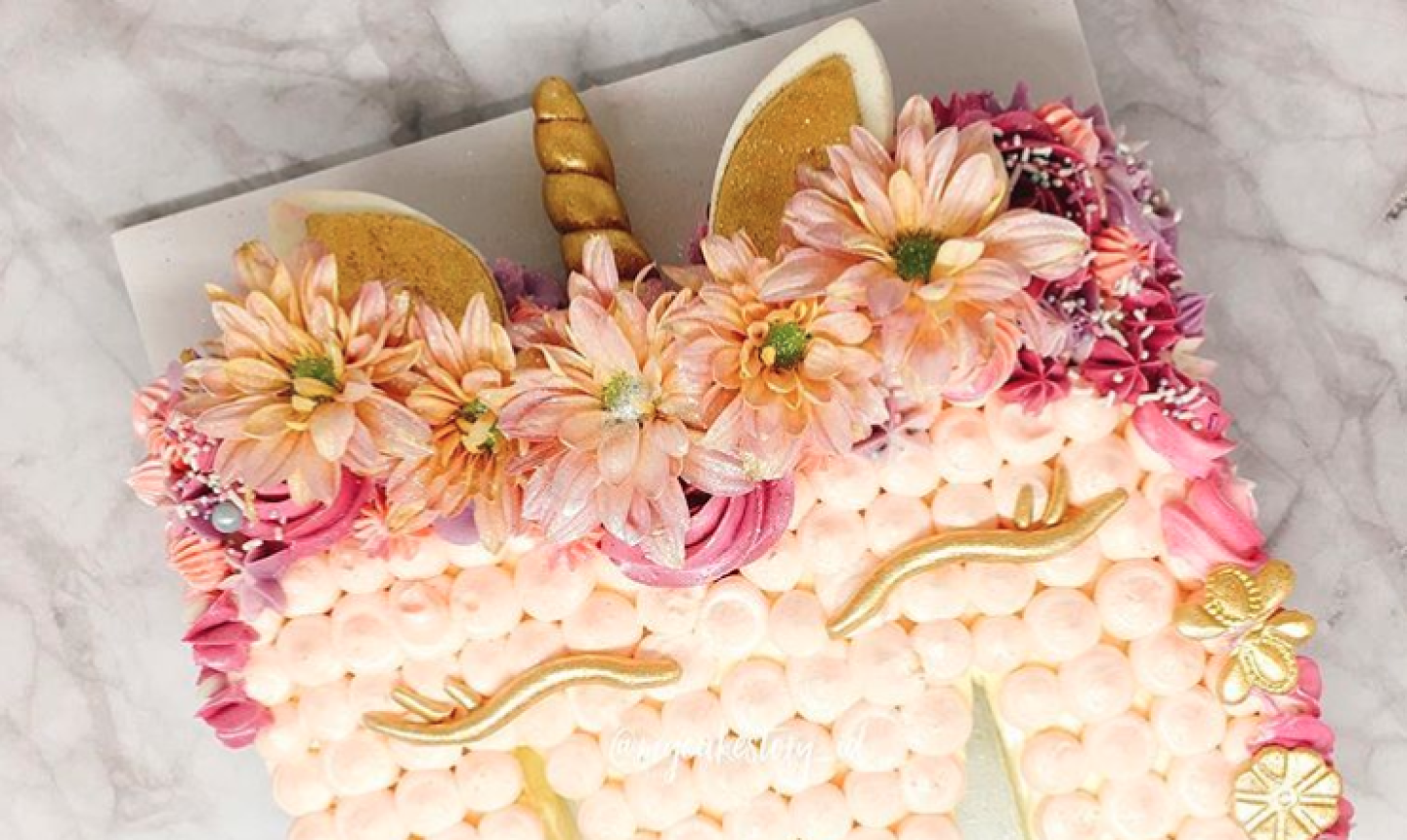 floral candy unicorn cake