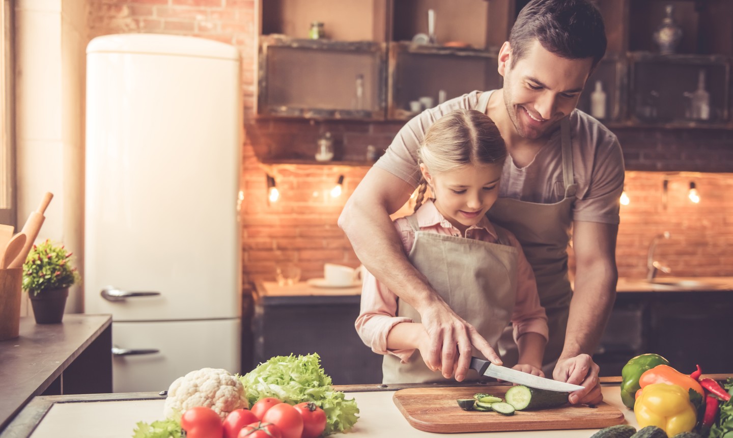 helping child in the kitchen