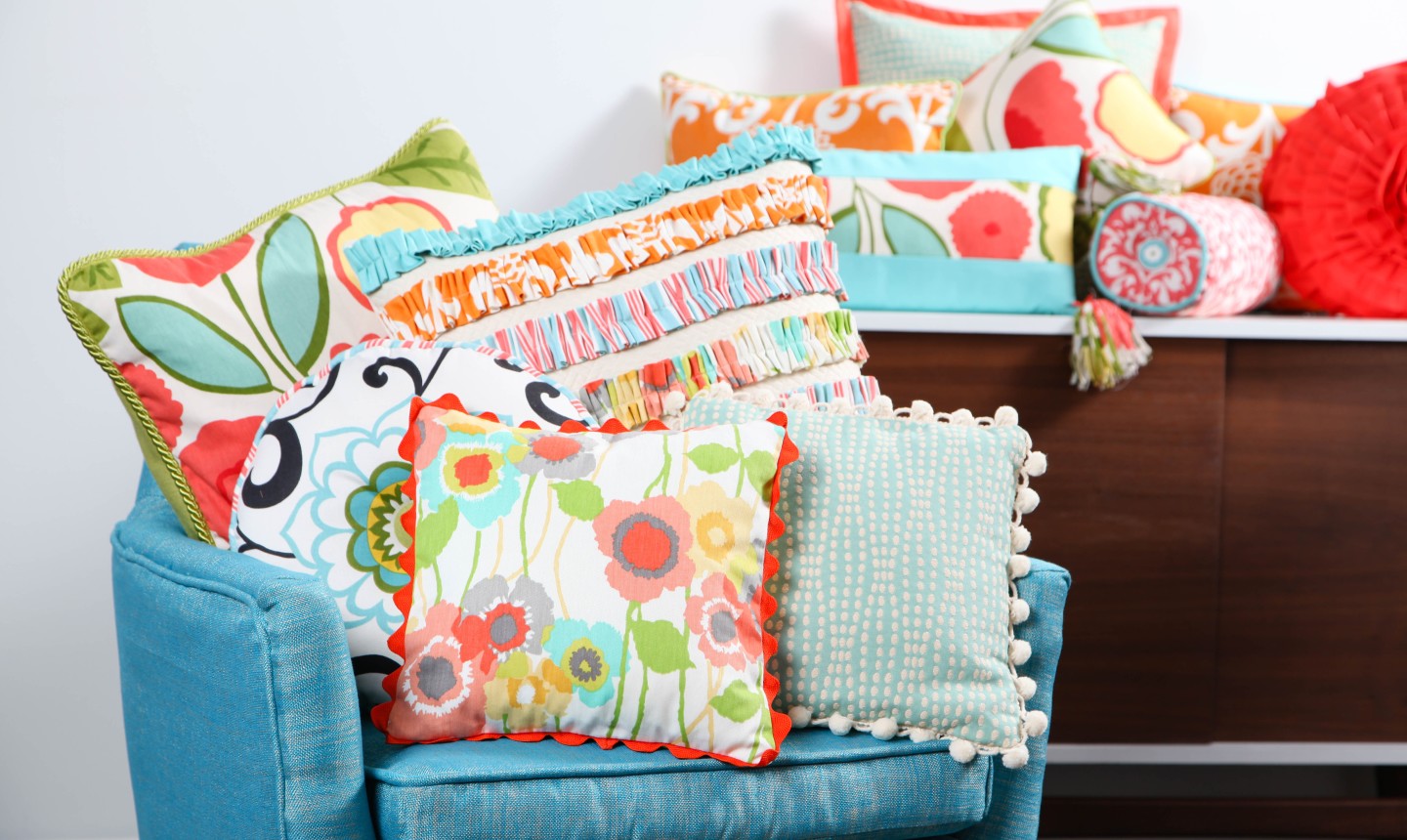 sewn pillows on a blue chair