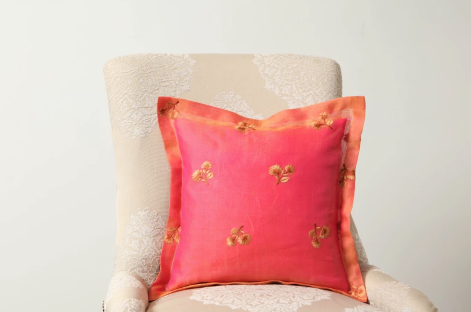 fancy sheer pillow on a beige chair