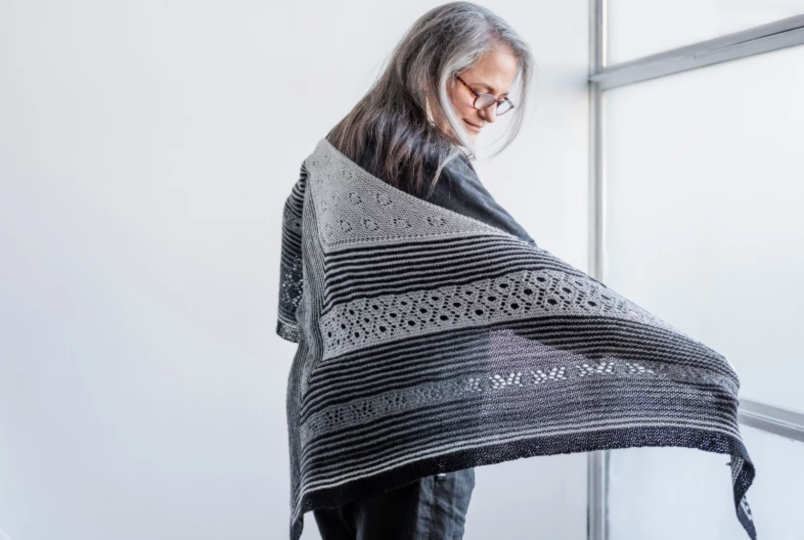 woman wearing knit shawl