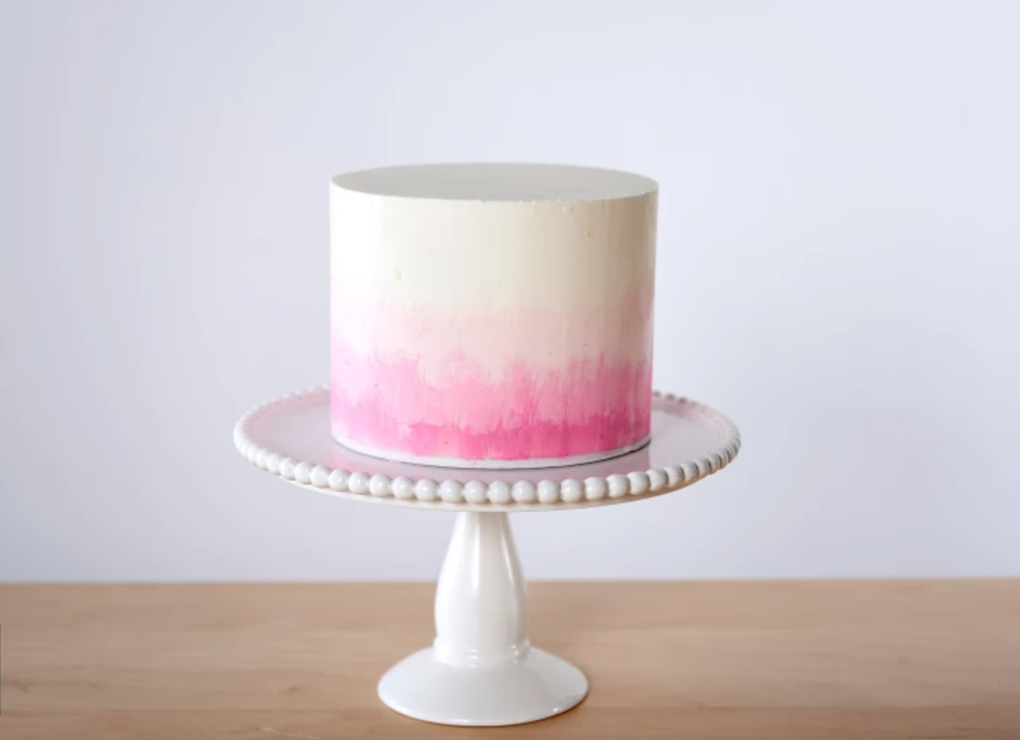 pink and white ombre buttercream cake