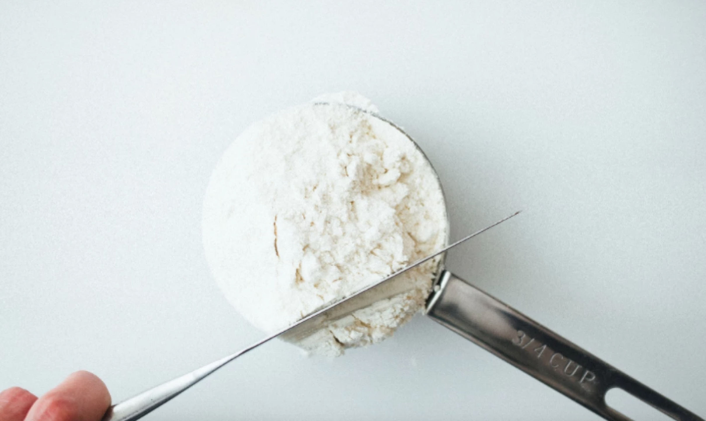 measuring cup of flour