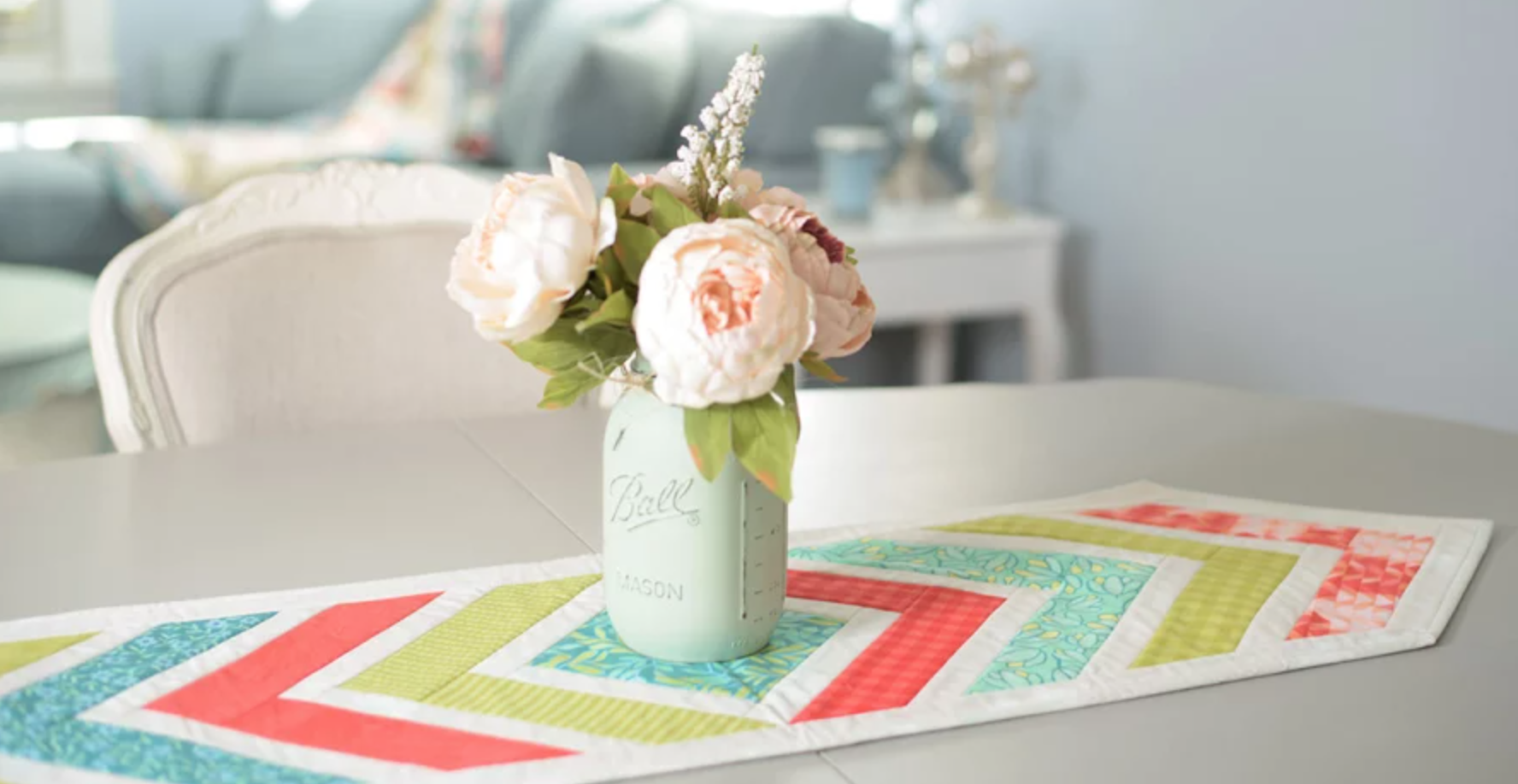 quilted table runner with bouquet centerpiece