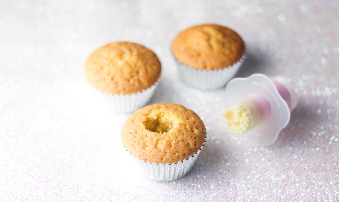 baked cupcakes with centers removed