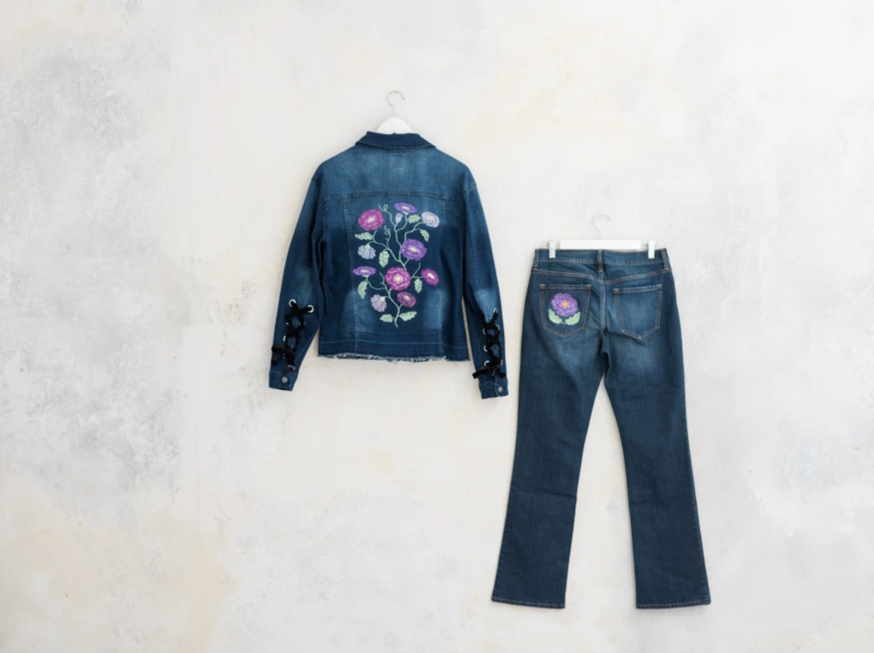 embroidered denim jacket and jeans