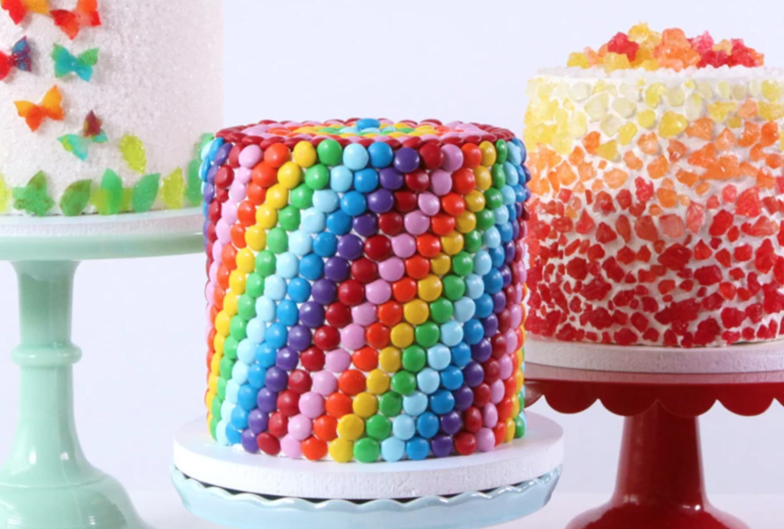 cakes covered in colorful candy