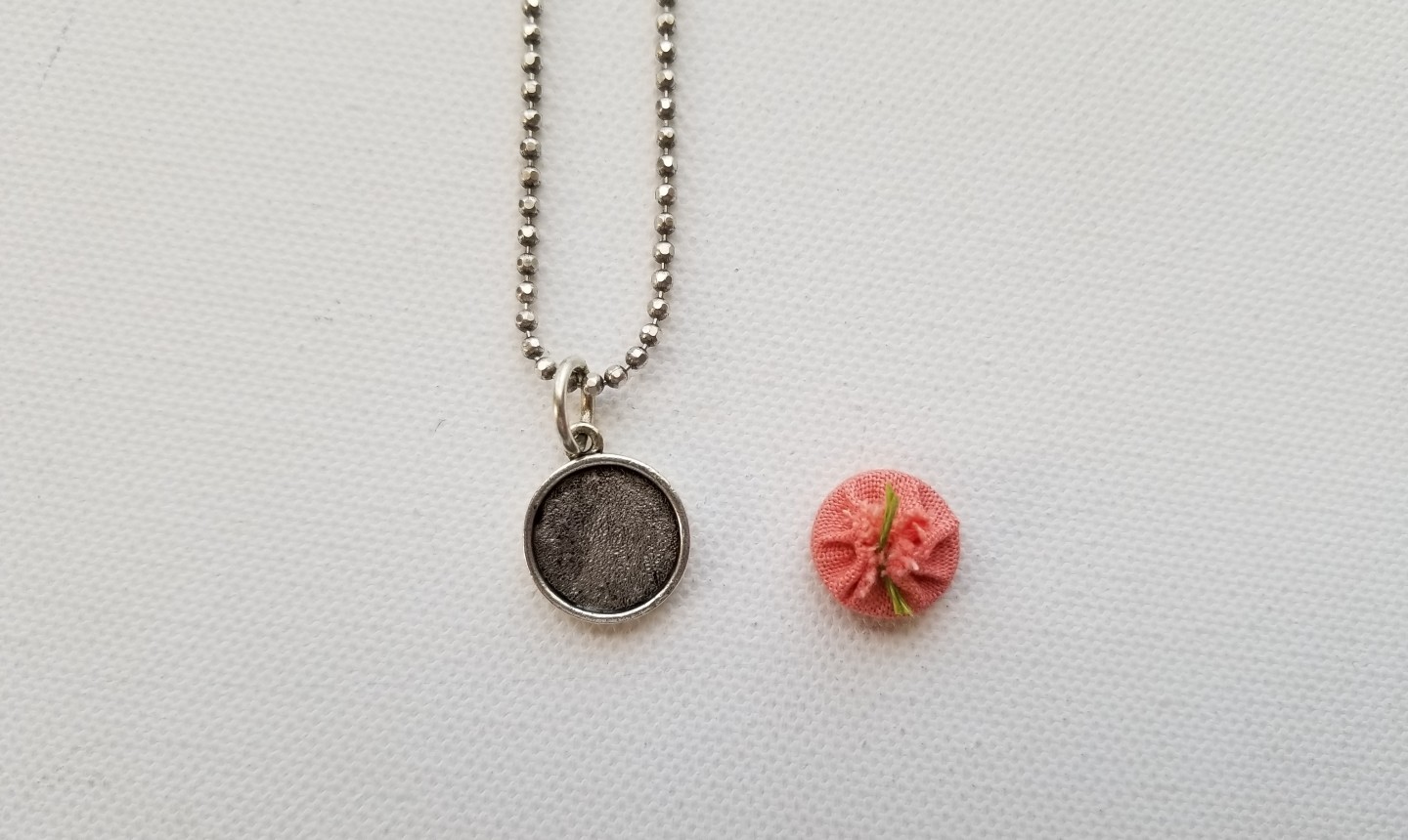 finishing back of embroidered pendant