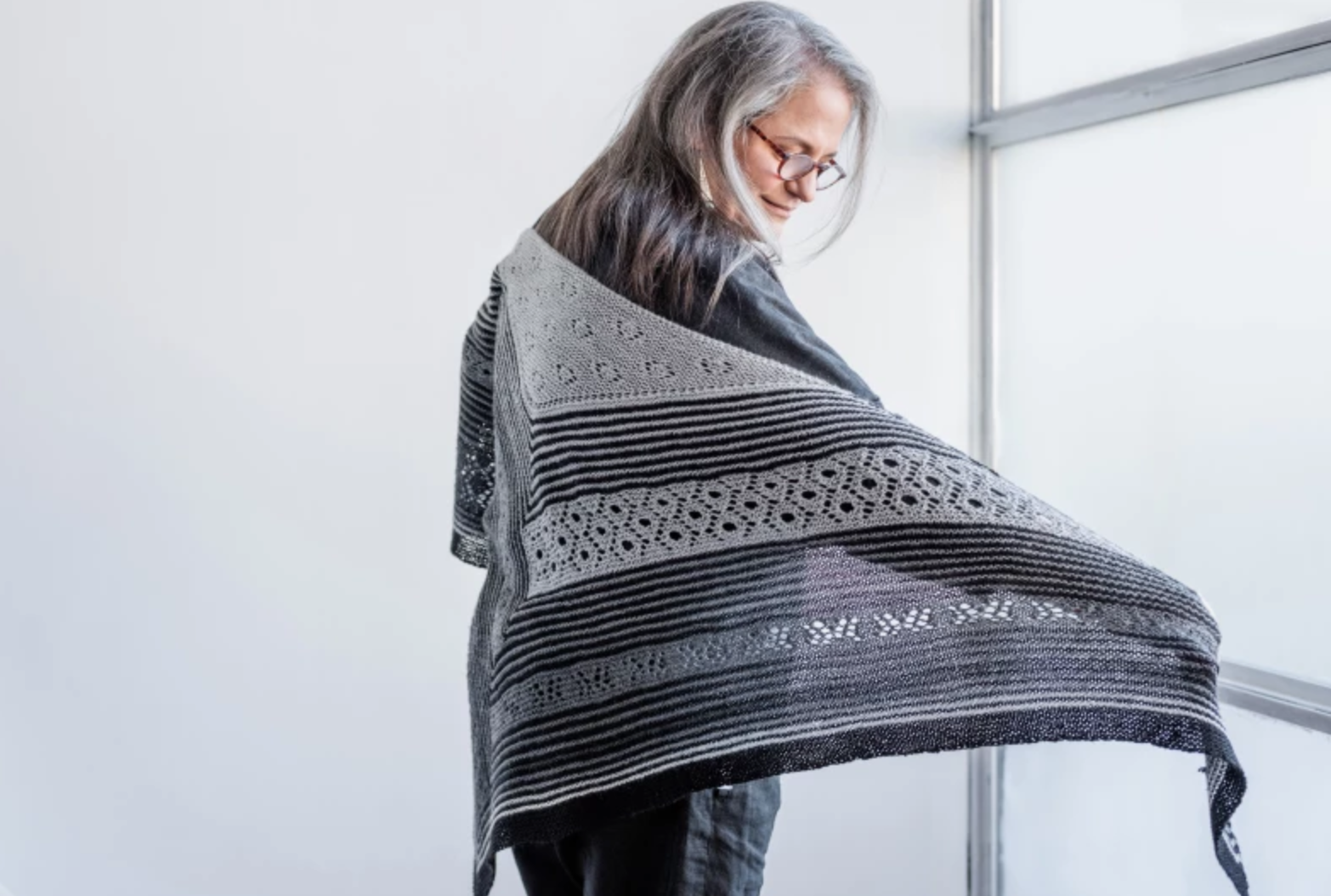 woman showing off high sierra shawl