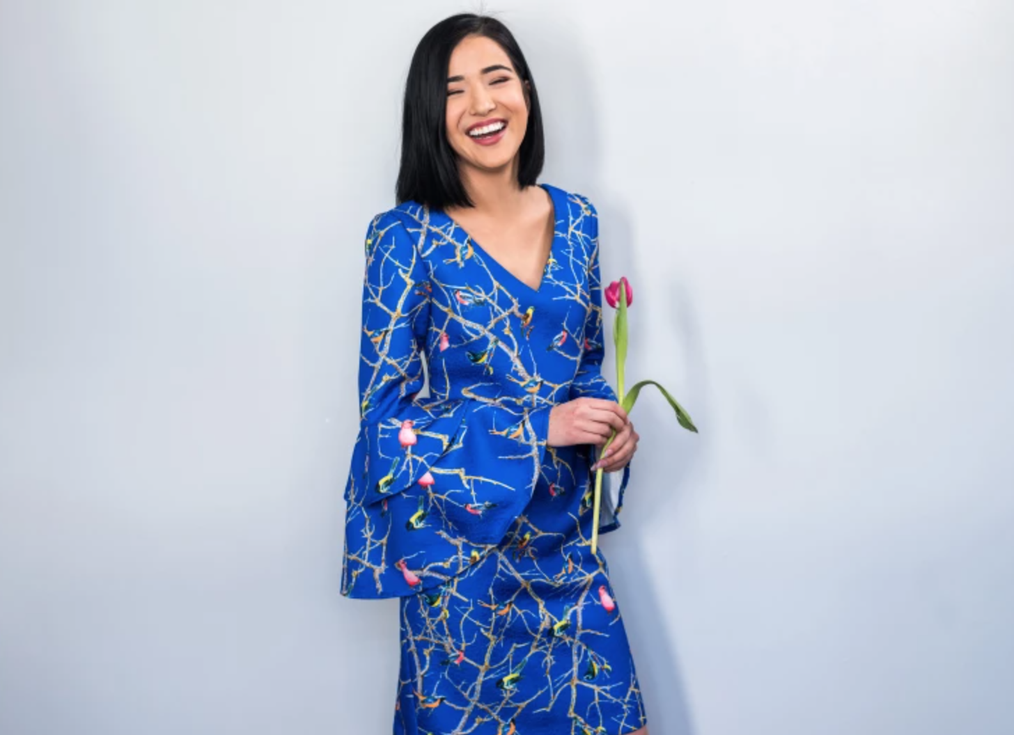 woman wearing blue flirty dress