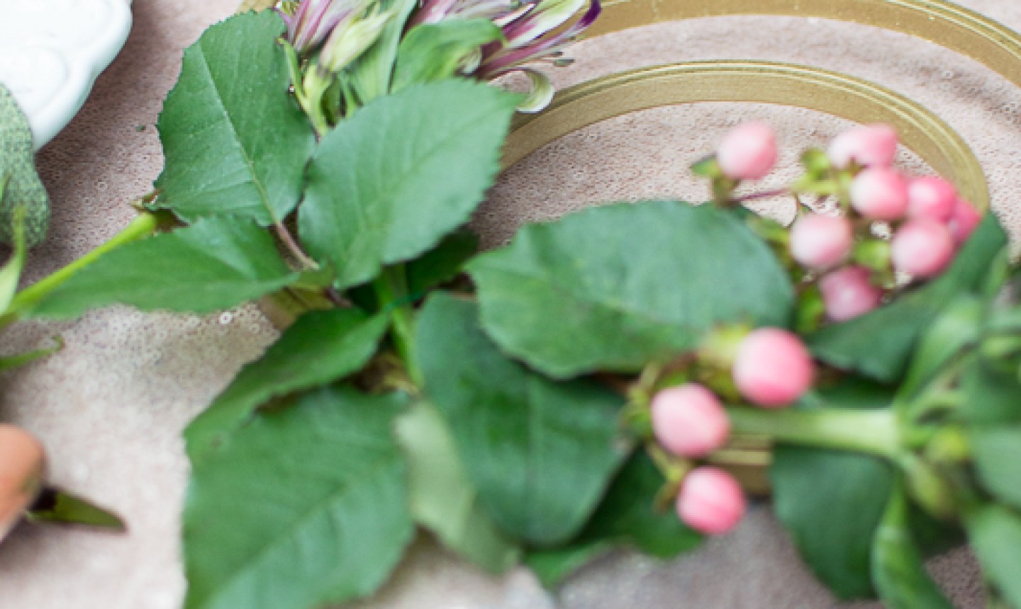 adding flowers to embroidery centerpiece