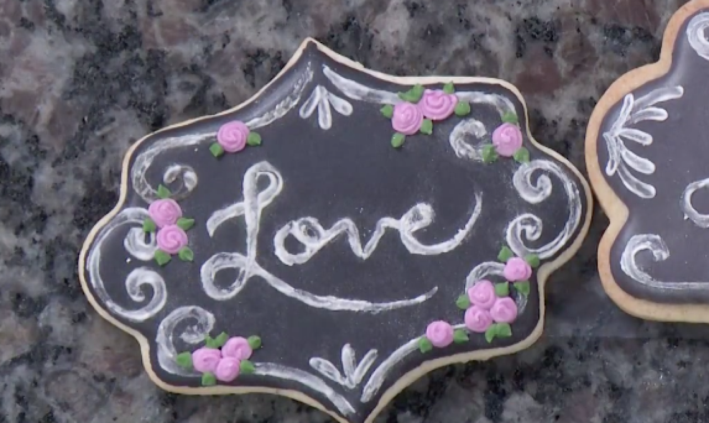 roses on chalkboard cookie