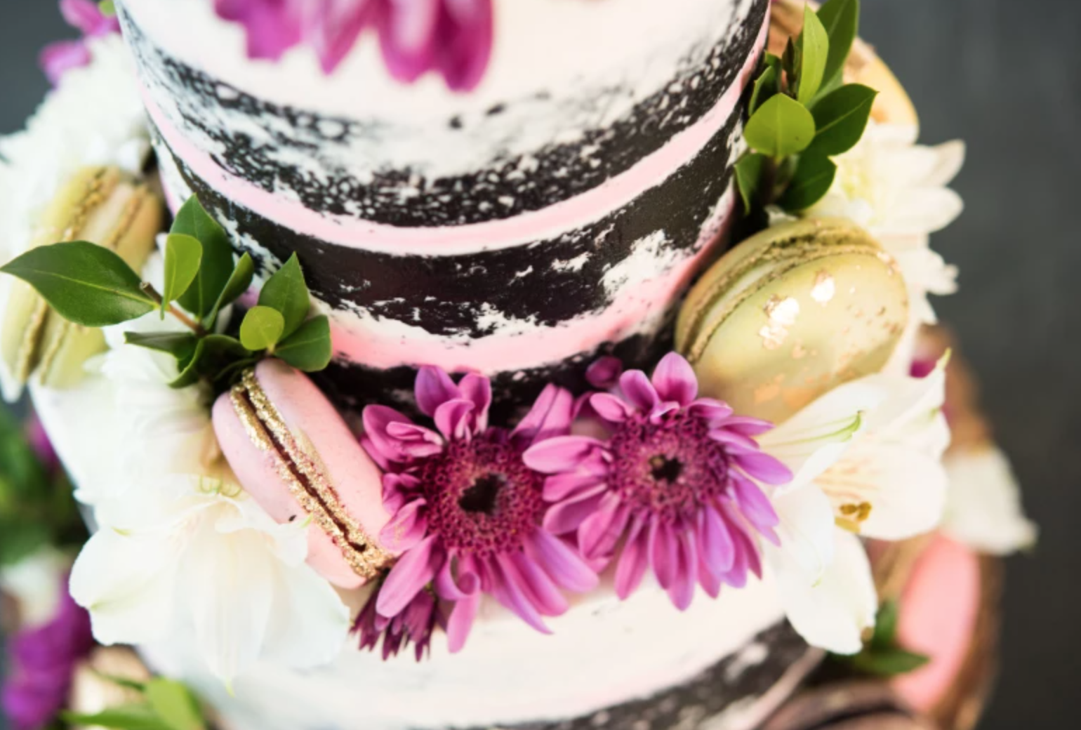 flowers and macaroons on naked cake