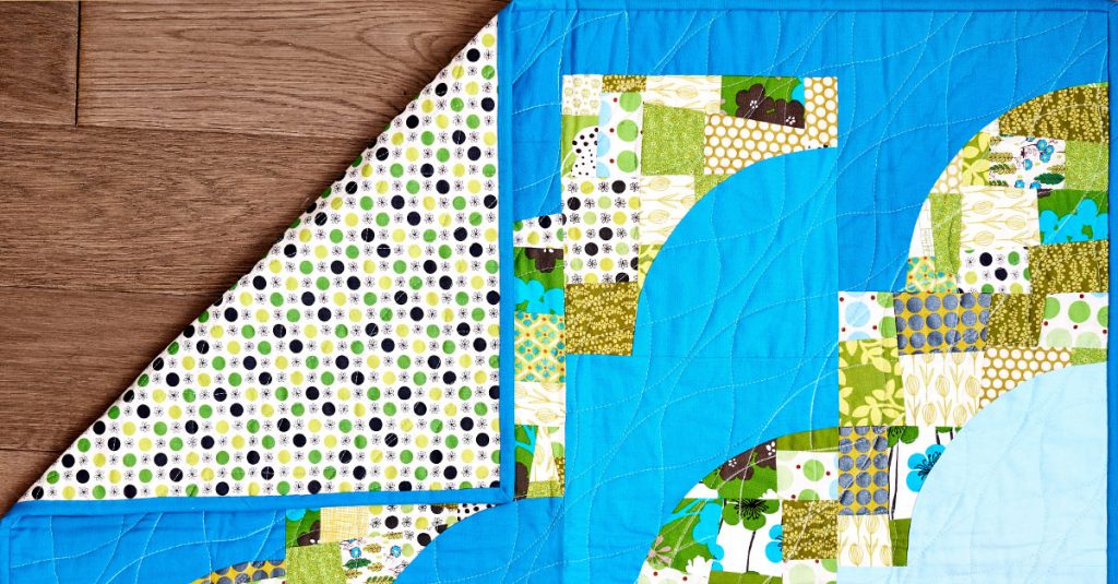 Corner of quilt folded over