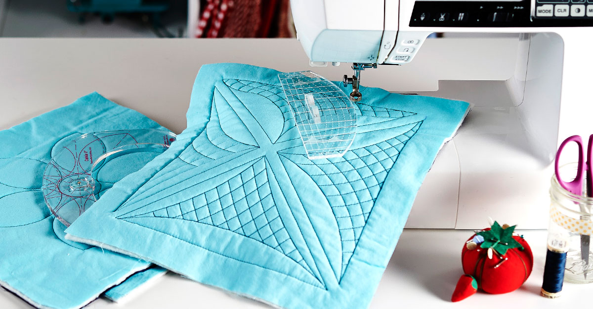Blue quilt square on a sewing machine