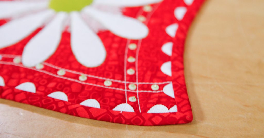 Corner of a white and red quilt