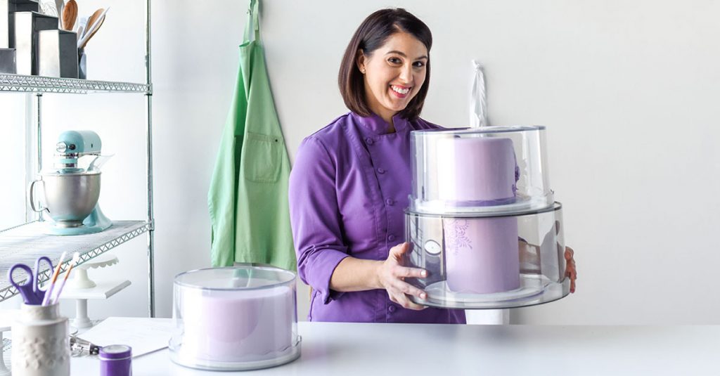 Woman holding a purple cake
