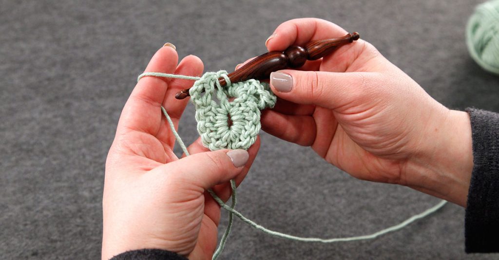 Crocheting with light green yarn