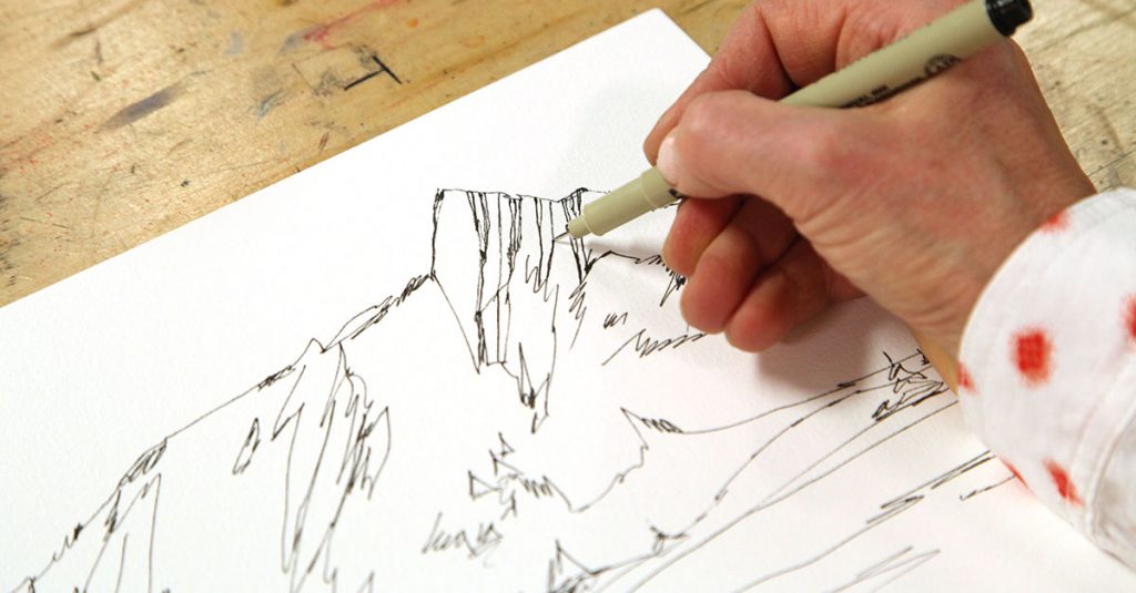 Sketching a landscape with a pen