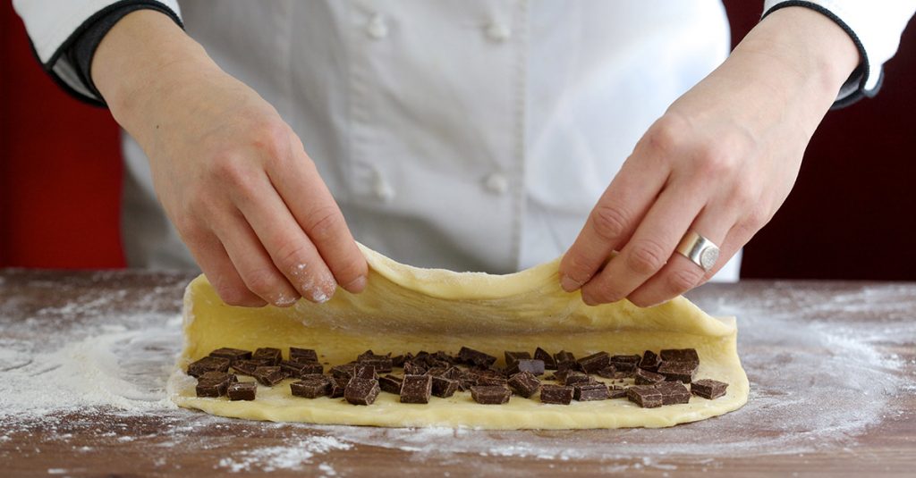Covering chocolate squares with dough