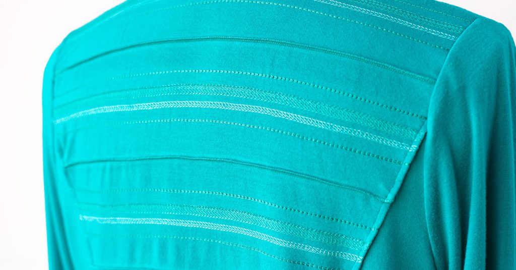 Stitching on the back of a shirt