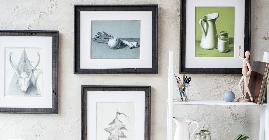 Still life paintings framed on a wall