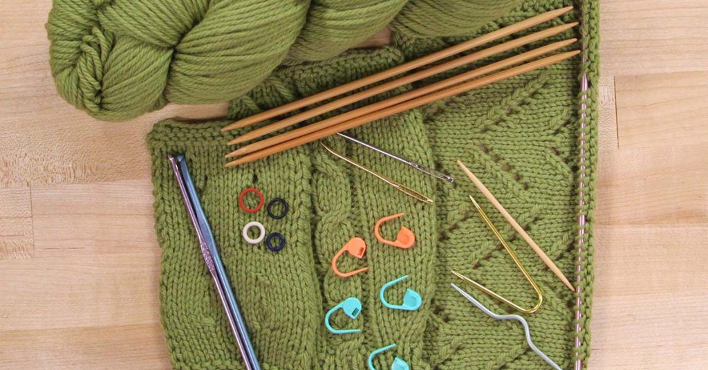 Knitting project with knitting accessories on top